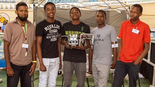 EAST MUCURAPO SECONDARY with their Coach, pose for a photo